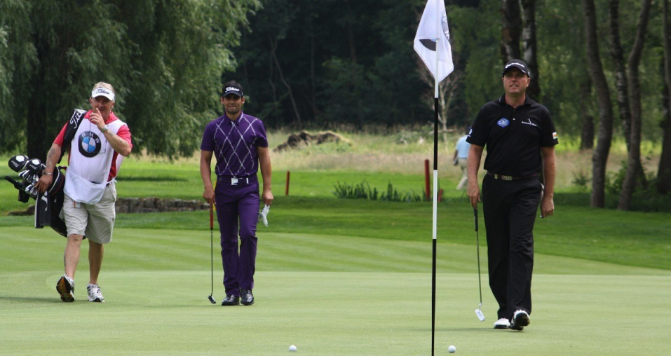  Image showing 3 players walking towards their golf balls near the golf pin flags representing popular golf point game, Bingo Bango Bongo